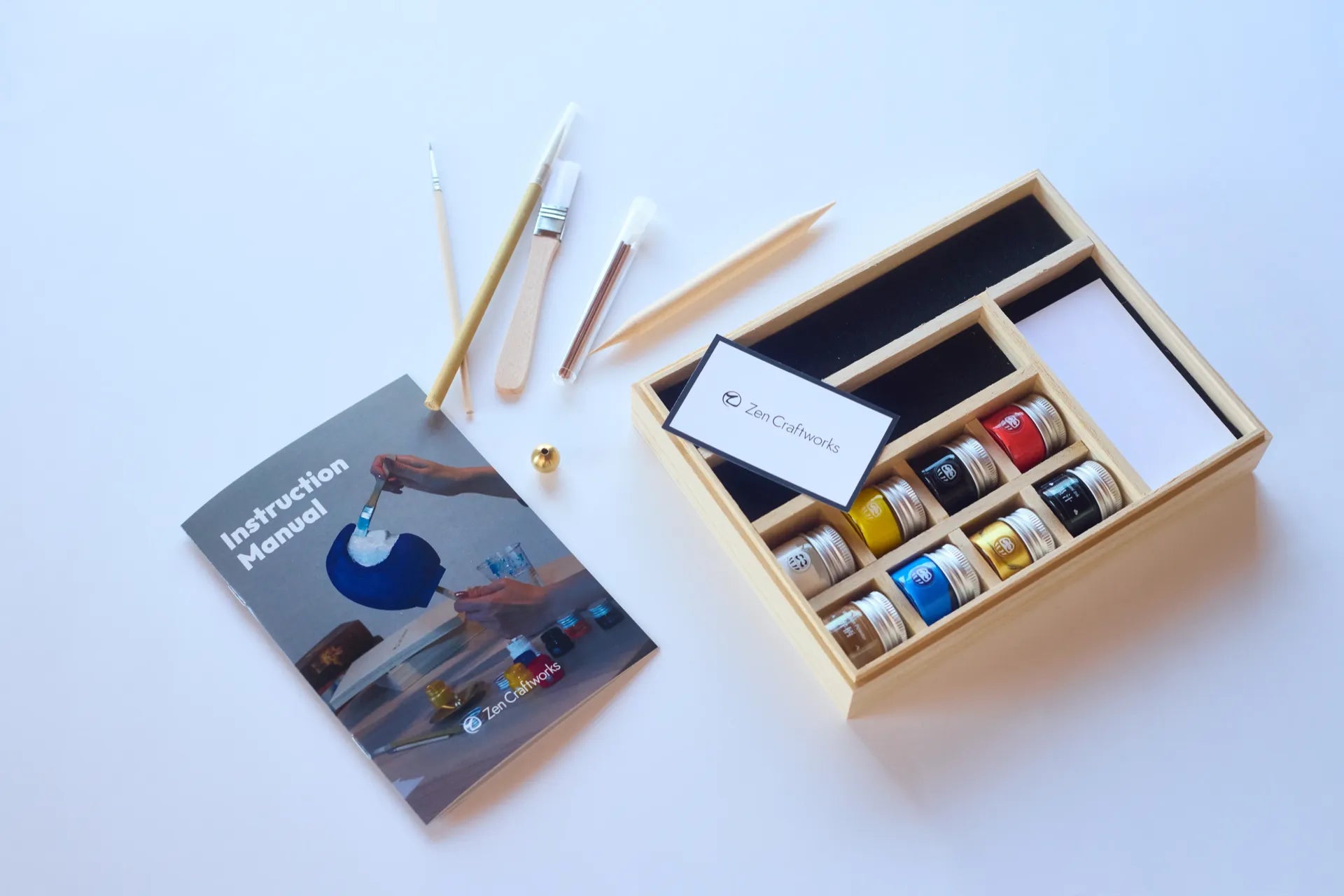 Artisan carefully painting a Daruma doll by hand